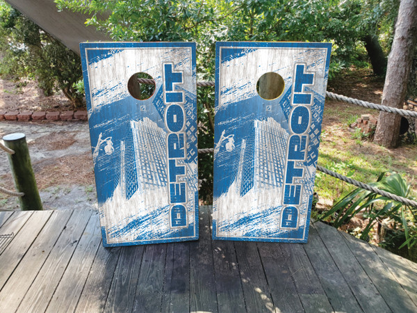"Detroit Sports Colors Cornhole Boards Design 1 featuring vibrant blue and silver color scheme inspired by Detroit sports teams with bold graphics"
