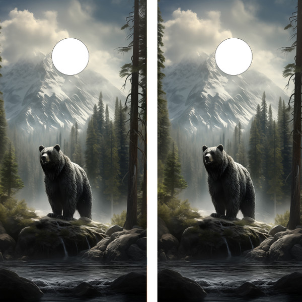 Pair of cornhole boards featuring a powerful grizzly bear standing on rocks near a river, surrounded by pine trees and set against a dramatic snow-capped mountain backdrop under a cloudy sky.