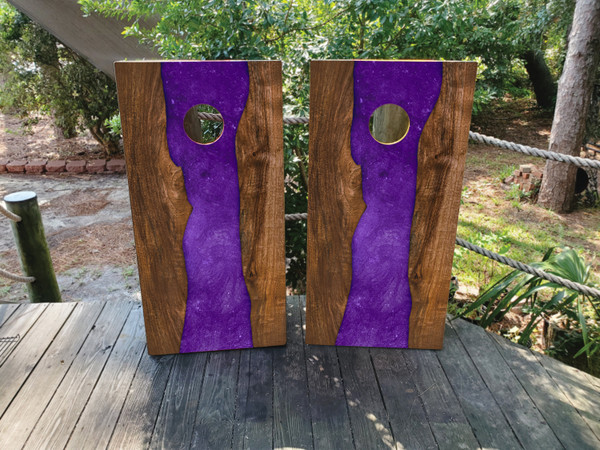 "Purple Epoxy Cornhole Boards featuring glossy resin finish with swirling purple patterns and natural wood accents"