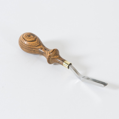 The straight french edger 3 is a 3/16" tool used for French edging and skiving. The handle is made of hard wood with a beautiful wood grain and a brass ferrule which is designed to fit the hand comfortably.