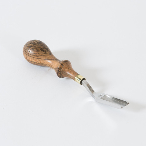 The straight french edger 6 is a 3/8" tool used for French edging and skiving. The handle is made of hard wood with a beautiful wood grain and a brass ferrule which is designed to fit the hand comfortably.