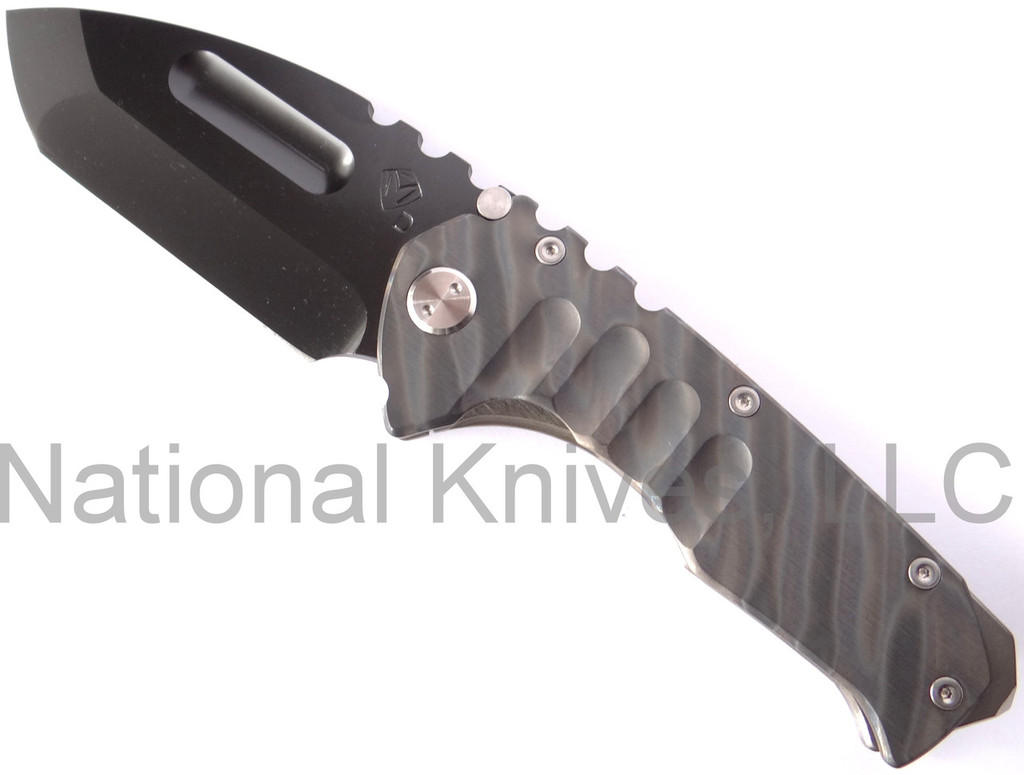 Medford Knives Praetorian folding knife with thumb groove - shown open presentation side.  Black Oxide D2 steel plain edge blade.  Flame anodized titanium handle.  Model MK12DPT-03FL.
For reference only.