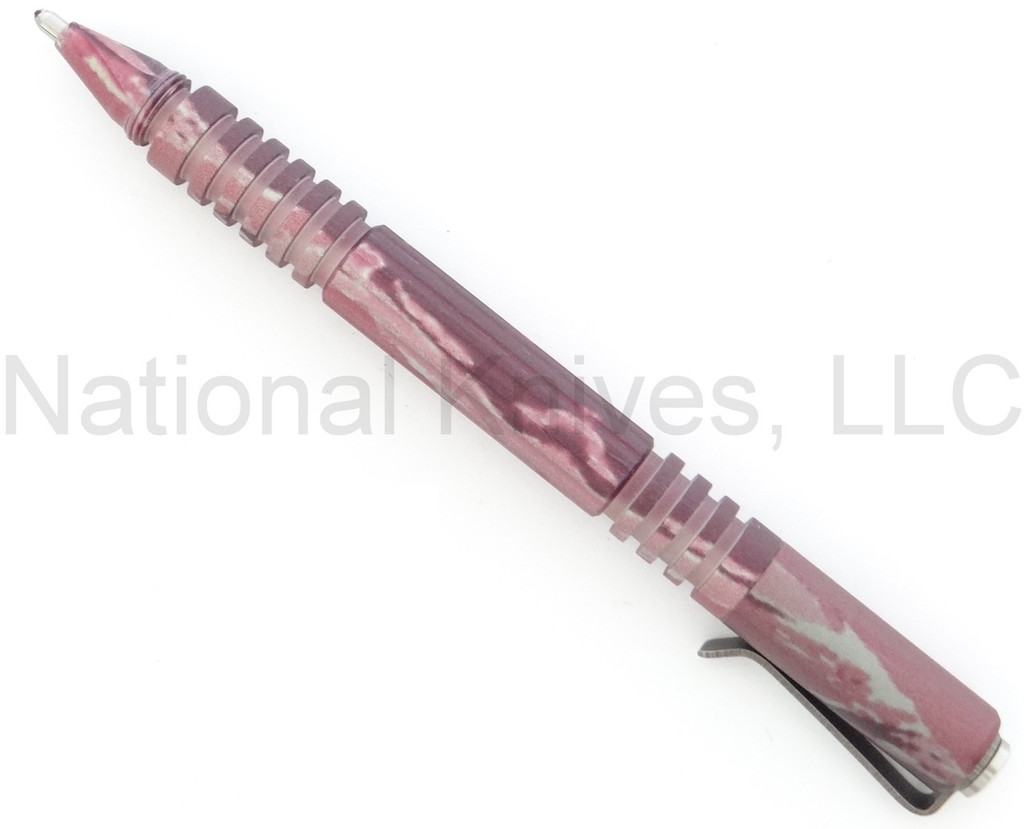 Rick Hinderer Knives Investigator ink pen - shown with cap attached to back.  DLC pink camo aluminum construction.  Model P5801004NP.
For reference only.
