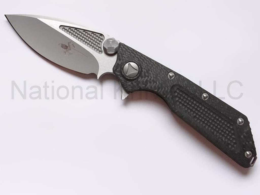 Microtech DOC Hand Ground folding knife - shown open - presentation side.  Two-Tone 154CM stainless steel plain edge blade.  Black carbon fiber handle.  Model 153-7DC.
For reference only.