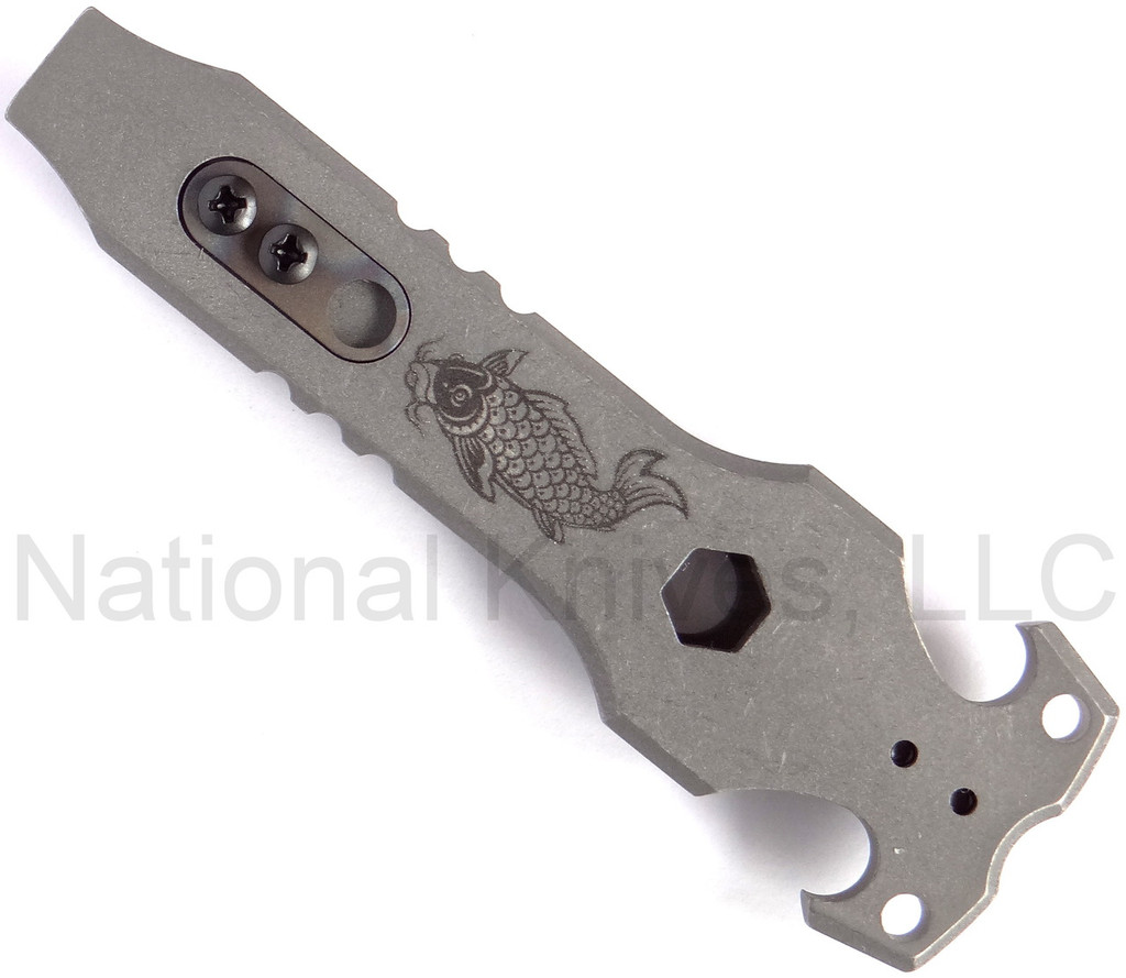Rick Hinderer Knives HS TacTool Steel Flame pocket tool - shown obverse.  Working Finish titanium construction.  Model T9000000CC.
For reference only.