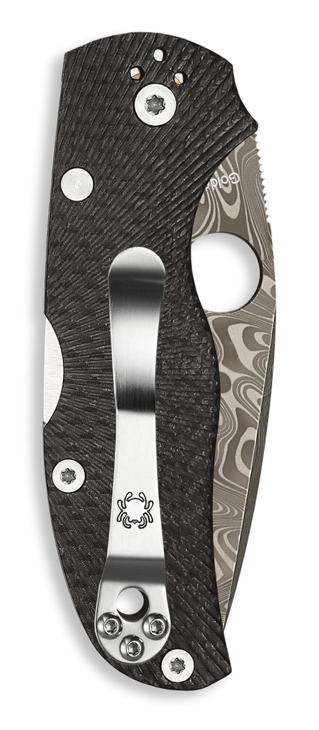 Spyderco Native 5 Sprint Run 40th Anniversary folding knife with thumb hole - shown closed pocket clip side.  DS93X Thor Damascus steel plain edge blade.  Black fluted carbon fiber handle.  Model C41CF40TH.
For reference only.