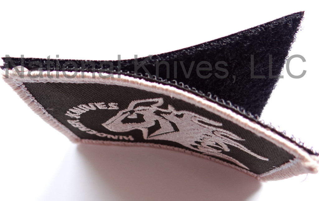 Rick Hinderer Knives Horse Head Logo Morale Patch - side view showing patch and back partially separated.  Yellow and black with hook and loop backing.  Model A001000000-YB.
For reference only.