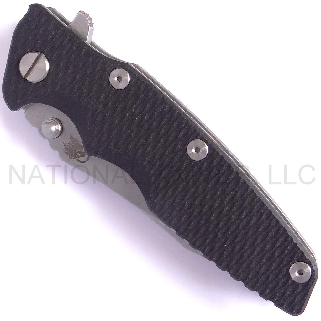 Rick Hinderer Knives Eklipse Tanto folding knife with thumb stud and flipper tab - shown closed presentation side.  Stonewash S35VN stainless steel plain edge blade.  Black G-10 handle with Working Finish lock side.  Model K40040TD00.
For reference only.