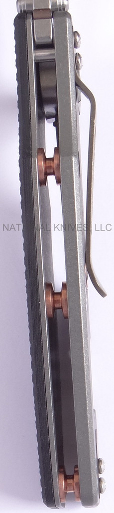 Rick Hinderer Knives Eklipse Tanto folding knife with thumb stud and flipper tab - shown open close up of standoffs.  Stonewash S35VN stainless steel plain edge blade.  Black G-10 handle with Working Finish lock side.  Model K40040TD00.
For reference only.