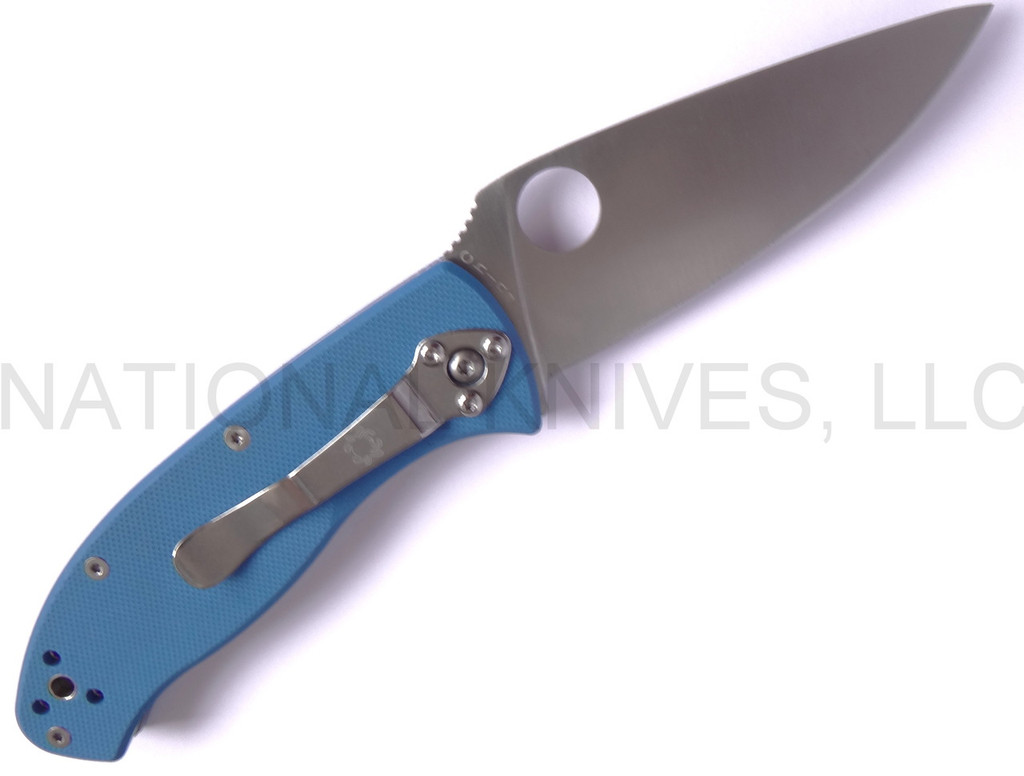 Spyderco Tenacious JB Outman Exclusive folding knife with thumb hole - shown open pocket clip side.  Satin 8Cr13MoV stainless steel plain edge blade.  Blue G-10 handle.  C122GPBL.
For reference only.