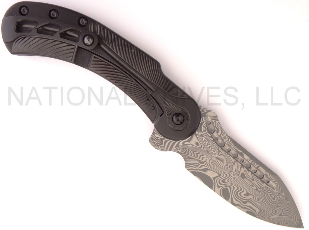 Todd Begg Knives Steelcraft Series Field Marshall folding knife - shown pocket clip side.  Grosserosen Damascus steel plain edge blade.  Black titanium handle.  Model FM214.
For reference only.