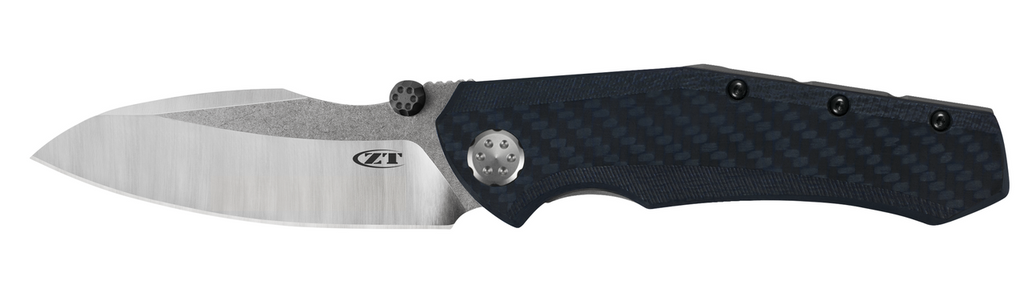 Zero Tolerance 0850 folding knife with thumb stud - shown open presentation side.  20CV stainless steel plain edge blade.  Blue and black carbon fiber handle.  Model 0850.
For reference only.