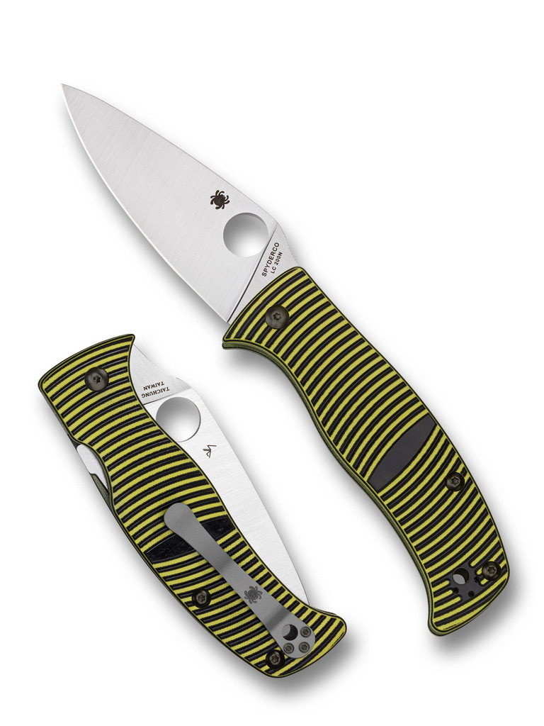Spyderco Caribbean folding knife with thumb hole - shown open presentation side and closed pocket clip side.  Satin LC200N stainless steel plain edge blade.  Black and yellow G-10 handle.  Model C217GP.
