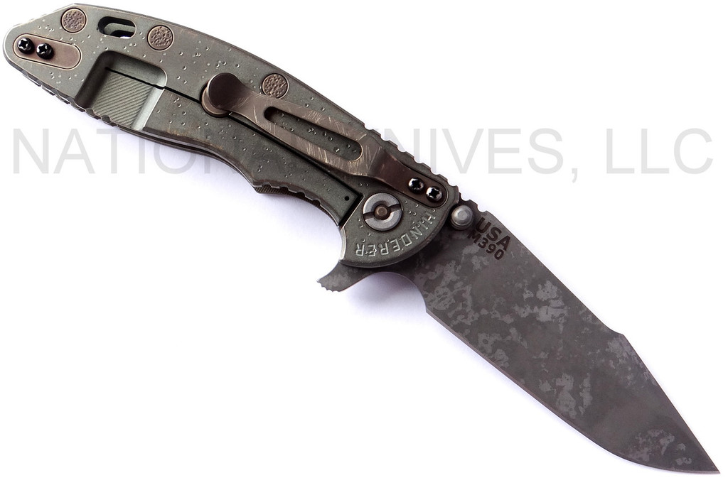 Rick Hinderer Knives Battlefield Pick Up XM-18 3.5" Harpoon Spanto folding knife with thumb stud and flipper tab - shown open lock side.  M390 stainless steel plain edge blade.  OD green G-10 handle with titanium lock side.  Model K25520SP00.
For reference only.