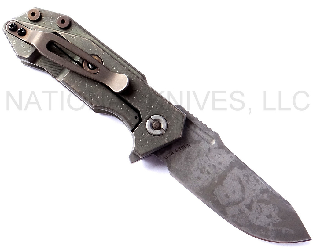 Rick Hinderer Knives Battle Field Pickup Half Track folding knife with flipper tab - shown open lock side.  S35VN stainless steel plain edge blade.  Smooth titanium handle.  Model K20090SPBF.
For reference only.