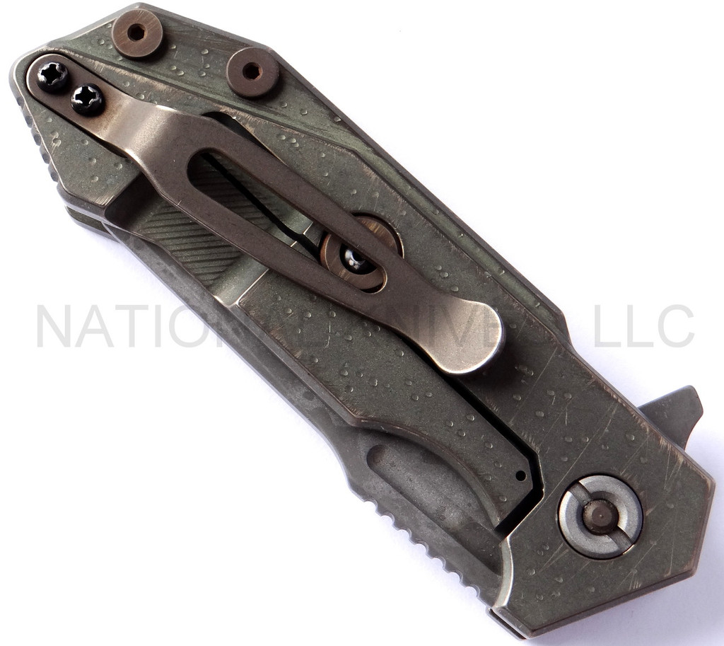 Rick Hinderer Knives Battle Field Pickup Half Track folding knife with flipper tab - shown closed lock side.  S35VN stainless steel plain edge blade.  Smooth titanium handle.  Model K20090SPBF.
For reference only.