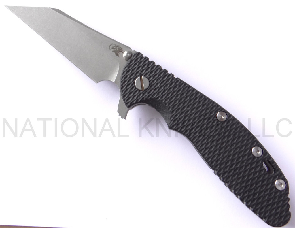 Rick Hinderer Knives Gearhead XM-24 Wharncliffe folding knife with thumb stud and flipper tab - shown open presentation side.  Working Finish M390 stainless steel plain edge blade.  Black G-10 handle with Working Finish lock side.  Model K3023SGW00.
For reference only.