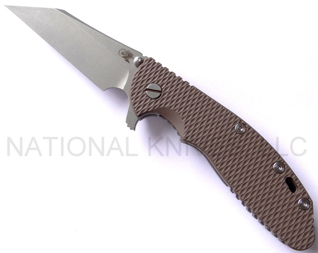 Rick Hinderer Knives Gearhead XM-24 Wharncliffe folding knife with thumb stud and flipper tab - shown open presentation side.  Working Finish M390 stainless steel plain edge blade.  FDE G-10 handle with Working Finish lock side.  Model K3023SGW00.
For reference only.