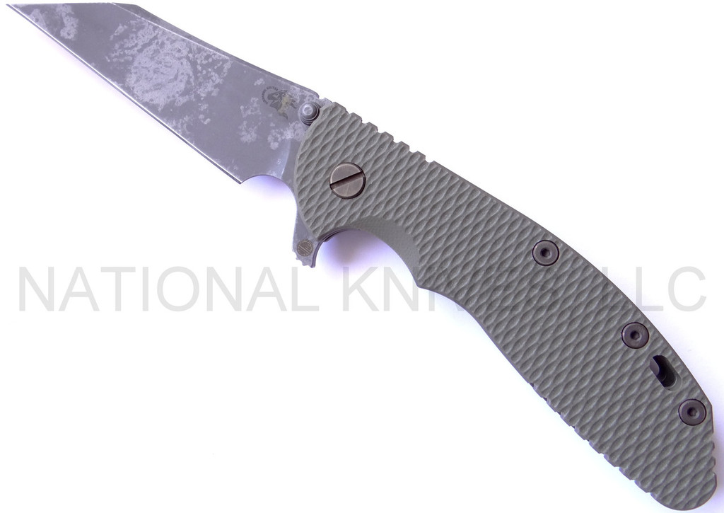 Rick Hinderer Knives Battlefield Pickup XM-24 Wharncliffe folding knife with thumb stud and flipper tab - shown open presentation side.  M390 stainless steel plain edge blade.  OD green G-10 handle with titanium lock side.  Model K30230SPBF.
For reference only.