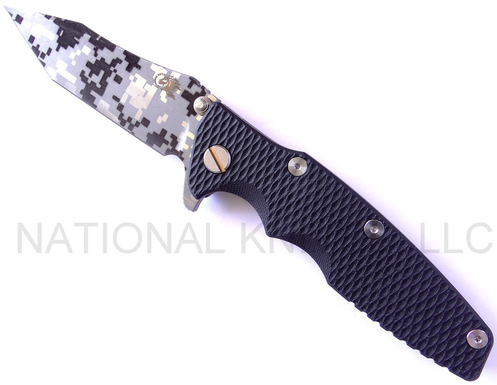 Rick Hinderer Knives Digi Camo Edition Eklipse Harpoon Tanto folding knife with thumb stud and flipper tab - shown open presentation side.  Working Finish 20CV stainless steel plain edge blade.  Black G-10 handle with Battle Bronze lock side.  Model K40042S000.
For reference only.