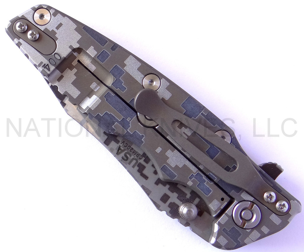 Rick Hinderer Knives Digi Camo Edition Eklipse Harpoon Tanto folding knife with thumb stud and flipper tab - shown closed lock side.  Working Finish 20CV stainless steel plain edge blade.  Black G-10 handle with Battle Bronze lock side.  Model K40042S000.
For reference only.