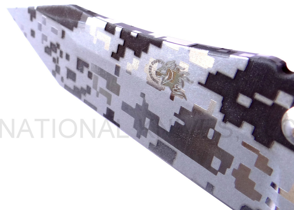 Rick Hinderer Knives Digi Camo Edition Eklipse Harpoon Tanto folding knife with thumb stud and flipper tab - close up of presentation side blade shown.  Working Finish 20CV stainless steel plain edge blade.  Black G-10 handle with Battle Bronze lock side.  Model K40042S000.
For reference only.