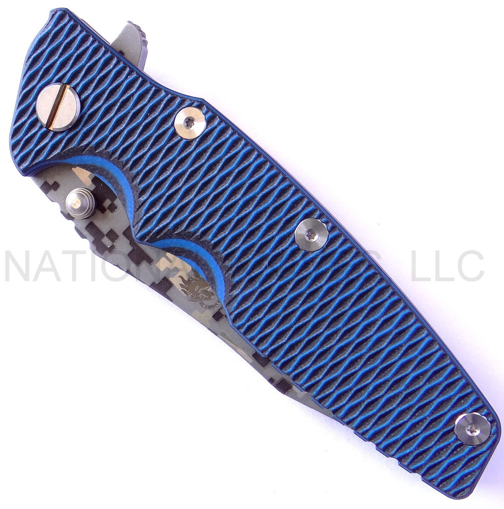 Rick Hinderer Knives Digi Camo Edition Eklipse Harpoon Tanto folding knife with thumb stud and flipper tab - shown closed presentation side.  Working Finish 20CV stainless steel plain edge blade.  Blue - black G-10 handle with Battle Blue lock side.  Model K40042S000.
For reference only.