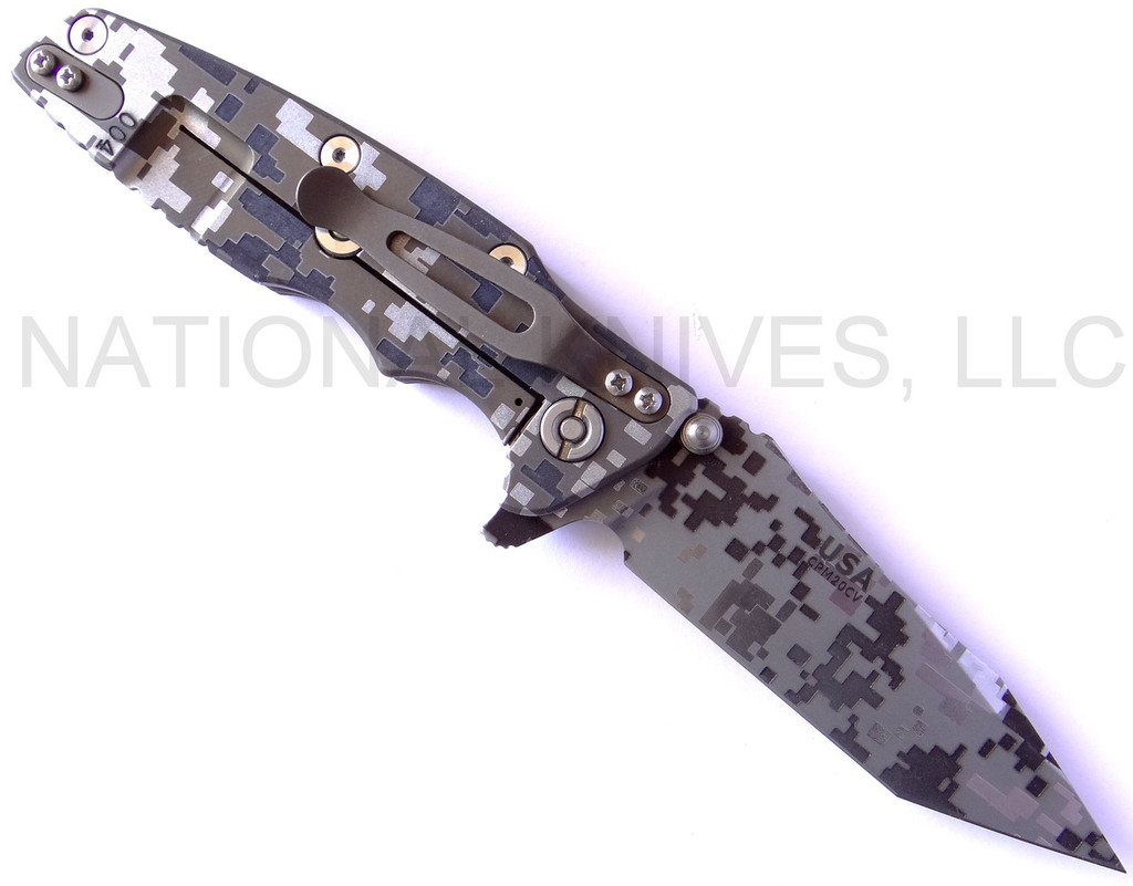 Rick Hinderer Knives Digi Camo Edition Eklipse Harpoon Tanto folding knife with thumb stud and flipper tab - shown open lock side.  Working Finish 20CV stainless steel plain edge blade.  OD green G-10 handle with Battle Bronze lock side.  Model K40042S000.
For reference only.