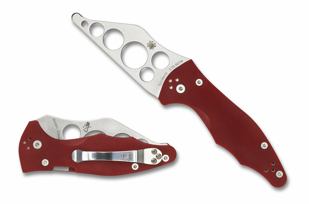 Spyderco Yojimbo 2 Trainer folding knife with thumb hole - shown open presentation side and closed pocket clip side.  CTS-BD1N stainless steel trainer blade.  Red G-10 handle. Model C85TR2.