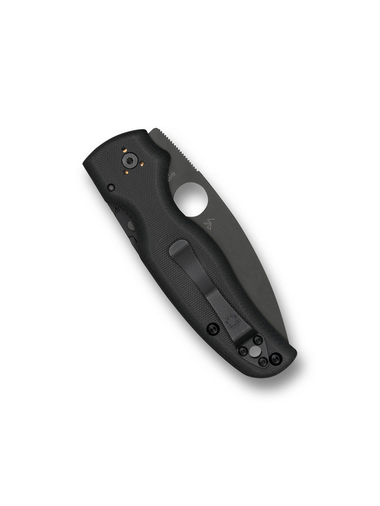 Spyderco Shaman folding knife with thumb hole - shown closed pocket clip side.  Black S30V stainless steel plain edge blade.  Black G-10 handle.  Model C229GPBK.