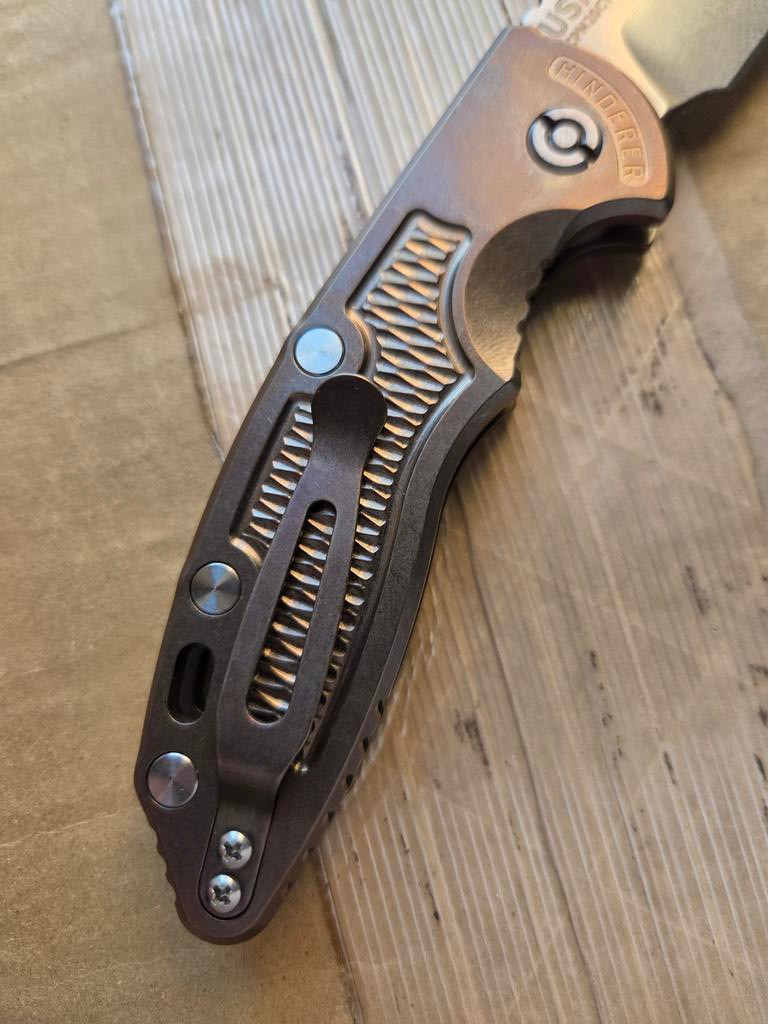 USED Rick Hinderer Knives XM-18 Automatic Spearpoint knife with push button - close up of pocket clip side handle shown.  Stonewash 20CV stainless steel plain edge blade.  Anodized bronze titanium handle. 