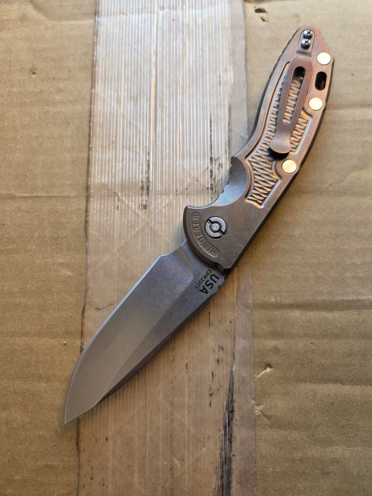 USED Rick Hinderer Knives XM-18 Automatic Spearpoint knife with push button - shown open pocket clip side.  Stonewash 20CV stainless steel plain edge blade.  Anodized bronze titanium handle. 