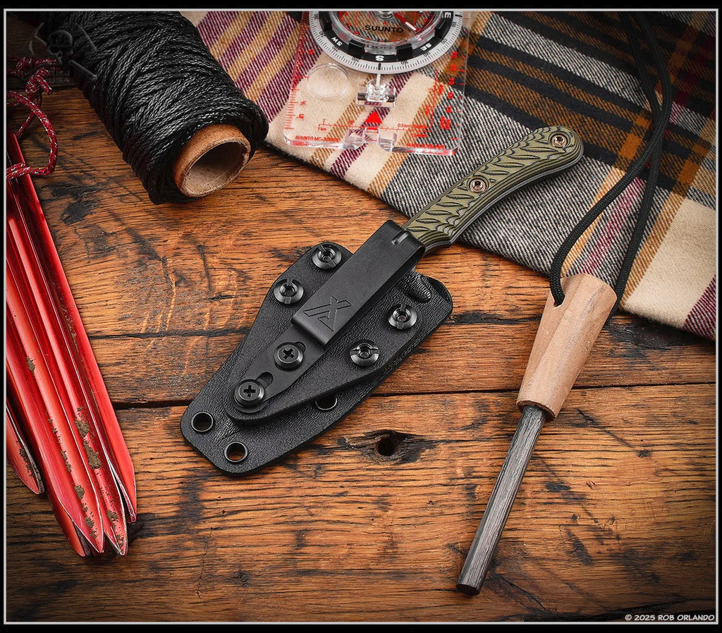 RMJ Tactical Sparrow fixed blade knife - shown in sheath obverse.  Tungsten Cerakote Nitro-V stainless steel plain edge blade.  Dirty Olive G-10 handle.  Model K-SP-TU-DO