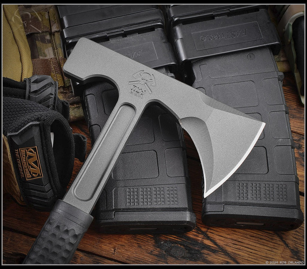 RMJ Tactical Loggerhead tomahawk - shown close up of head out of sheath obverse.  Tungsten Cerakote 80CRV2 plain edge head.  Black rubber handle.  Model T-L15-TU-BL.