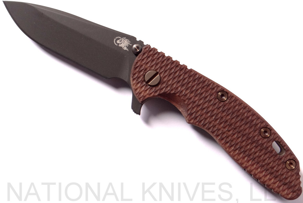 Rick Hinderer Knives Vintage Series XM-18 3.5" Spear Point folding knife with thumb stud and flipper tab - shown open presentation side.  Black O-1 steel plain edge blade.  Textured Walnut handle with Battle Green lock side.  Model K2082SWPK.
For reference only.