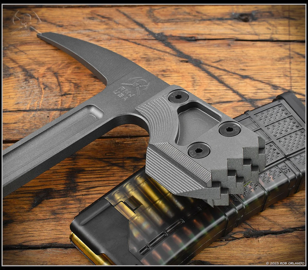 RMJ Tactical Snuggles 18" tactical hammer - shown close up of head obverse.  Tungsten Cerakote 80CRV2 steel head.  Dirty Olive G-10 handle.