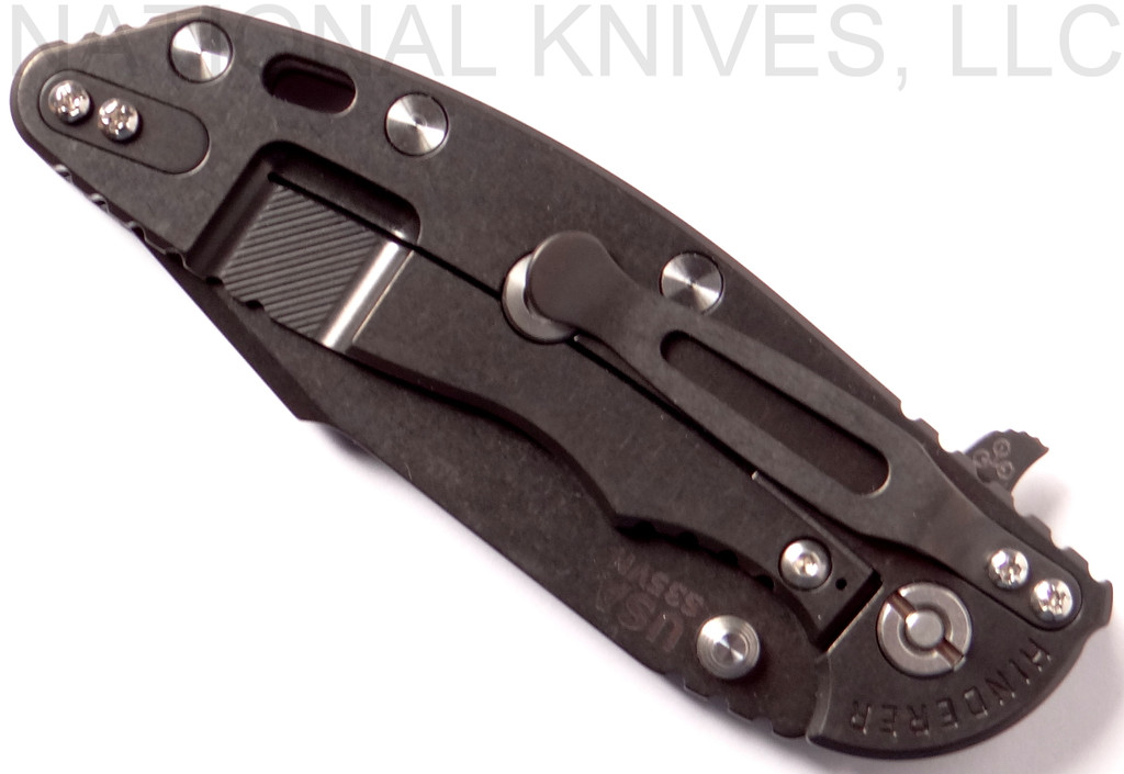 Rick Hinderer Knives XM-18 3.5" Harpoon Spanto folding knife with thumb stud and flipper tab - shown closed lock side.  Black stonewash S35VN stainless steel plain edge blade.  Black G-10 handle with stonewash black lock side.  Model K2552SGD00.