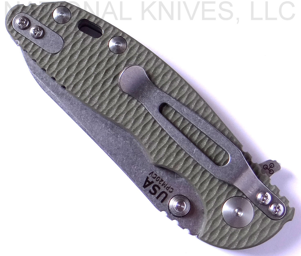 Rick Hinderer Knives Skinny XM-18 3.0" Sheepsfoot folding knife with thumb stud and flipper tab - shown closed pocket clip side.  Stonewash 20CV stainless steel plain edge blade.  OD green G-10 handle with stonewash lock.  Model K1101SSGS00.