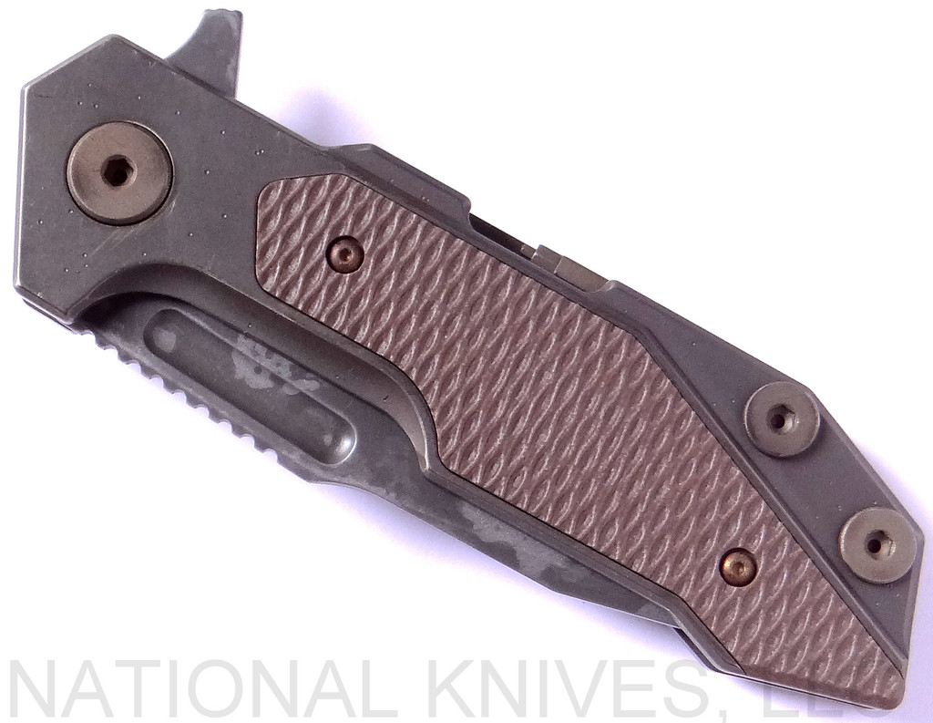 Rick Hinderer Knives Battle Field Pick Up Full Track Spear Point folding knife with flipper tab - shown closed presentation side.  20CV stainless steel plain edge blade.  FDE G-10 handle with titanium lock side.  Model K208TSBFPU.
For reference only.

