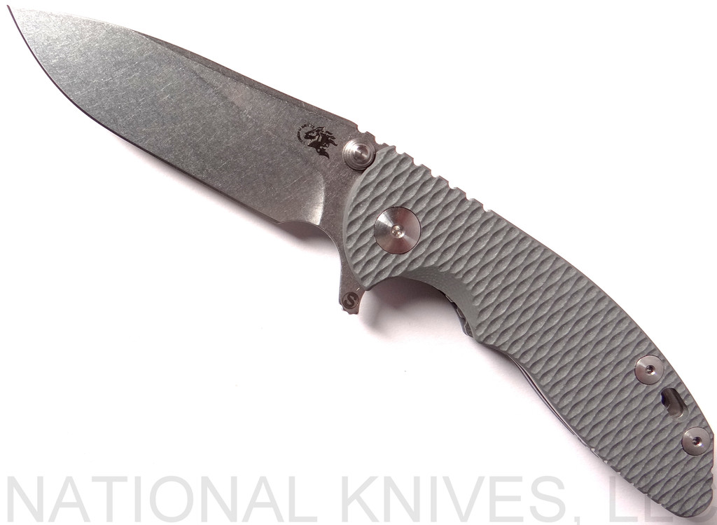 Rick Hinderer Knives Skinny XM-18 Slicer folding knife with thumb studs and flipper tab - shown open presentation side.  Stonewash 20CV stainless steel plain edge blade.  Grey G-10 handle with stonewash lock.  Model K1011SSGS00.