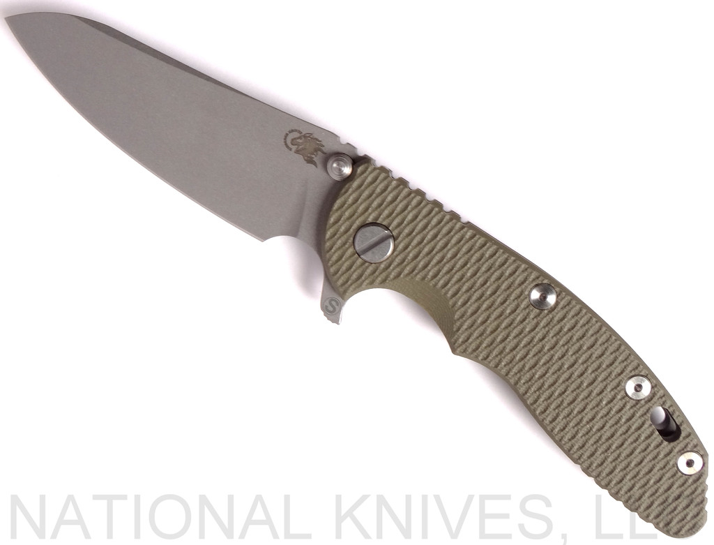 Rick Hinderer Knives Skinny XM-18 3.5" Sheepsfoot folding knife with thumb stud and flipper tab - shown open presentation side.  Working Finish 20CV stainless steel plain edge blade.  OD green G-10 handle with Working Finish lock side.  Model K2525SGS00.