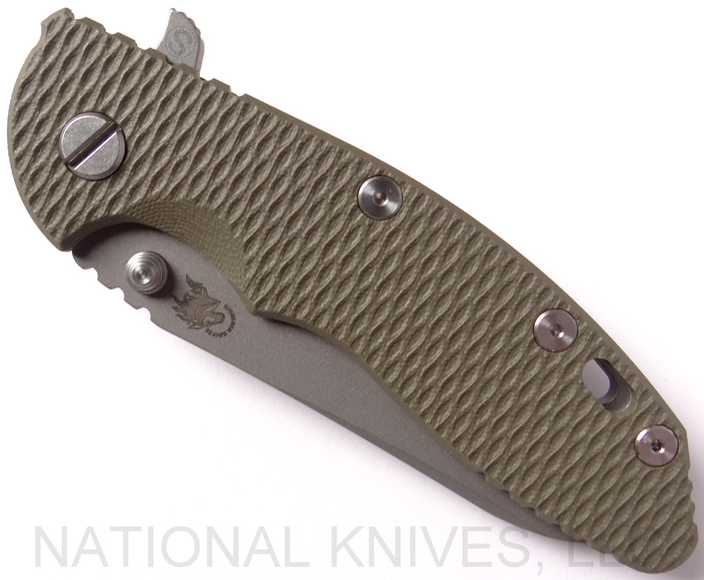 Rick Hinderer Knives Skinny XM-18 3.5" Sheepsfoot folding knife with thumb stud and flipper tab - shown closed presentation side.  Working Finish 20CV stainless steel plain edge blade.  OD green G-10 handle with Working Finish lock side.  Model K2525SGS00.
