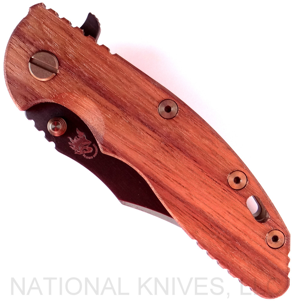 Rick Hinderer Knives Vintage Series XM-18 3.5" Bowie folding knife with thumb stud and flipper tab - shown closed presentation side.  Black O-1 steel plain edge blade.  Smooth Walnut handle with Battle Green titanium lock side.  Model K2032S0VT.
For reference only.