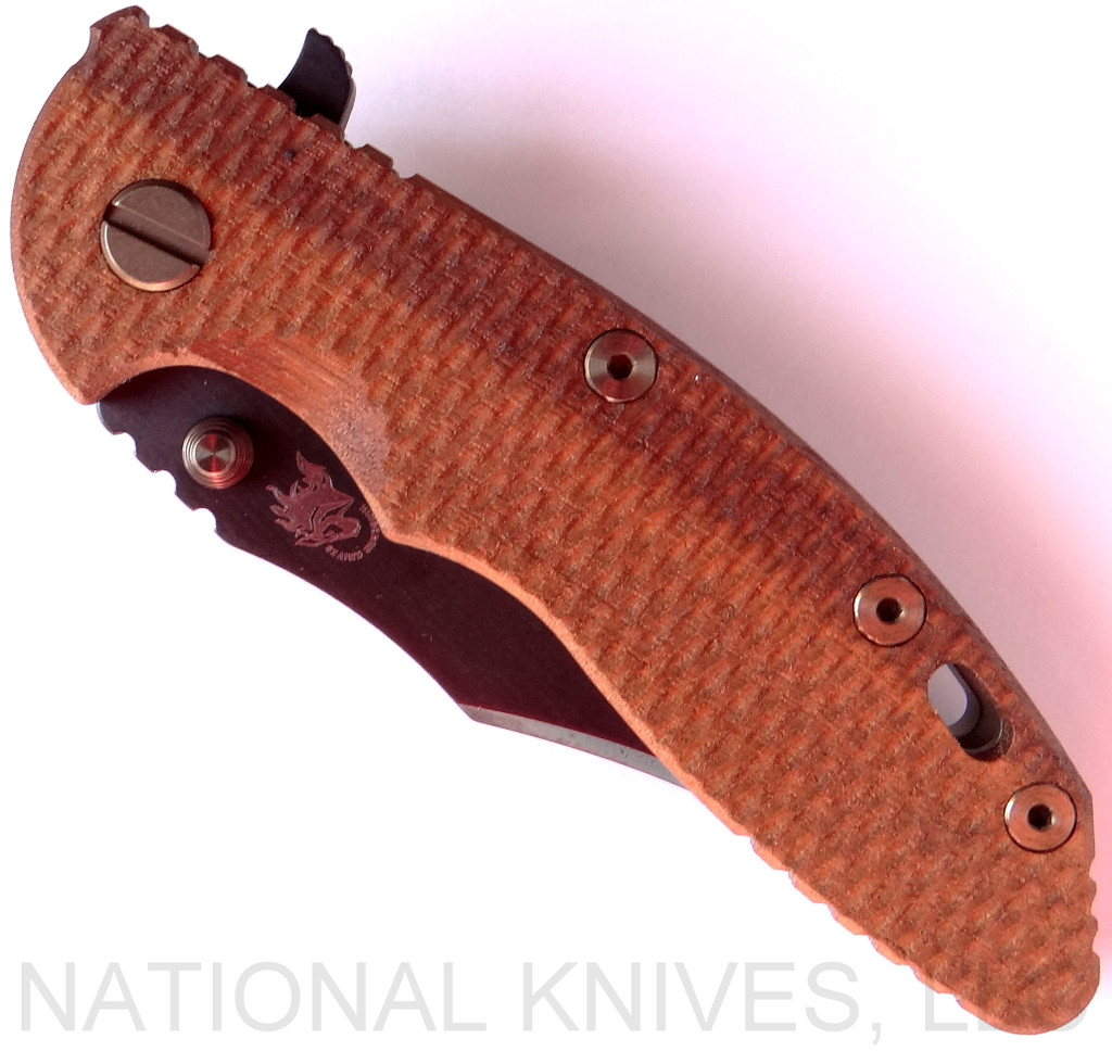 Rick Hinderer Knives Vintage Series XM-18 3.5" Bowie folding knife with thumb stud and flipper tab - shown closed presentation side.  Black O-1 steel plain edge blade.  Textured Walnut handle with Battle Green titanium lock side.  Model K2032S0VT.
For reference only.