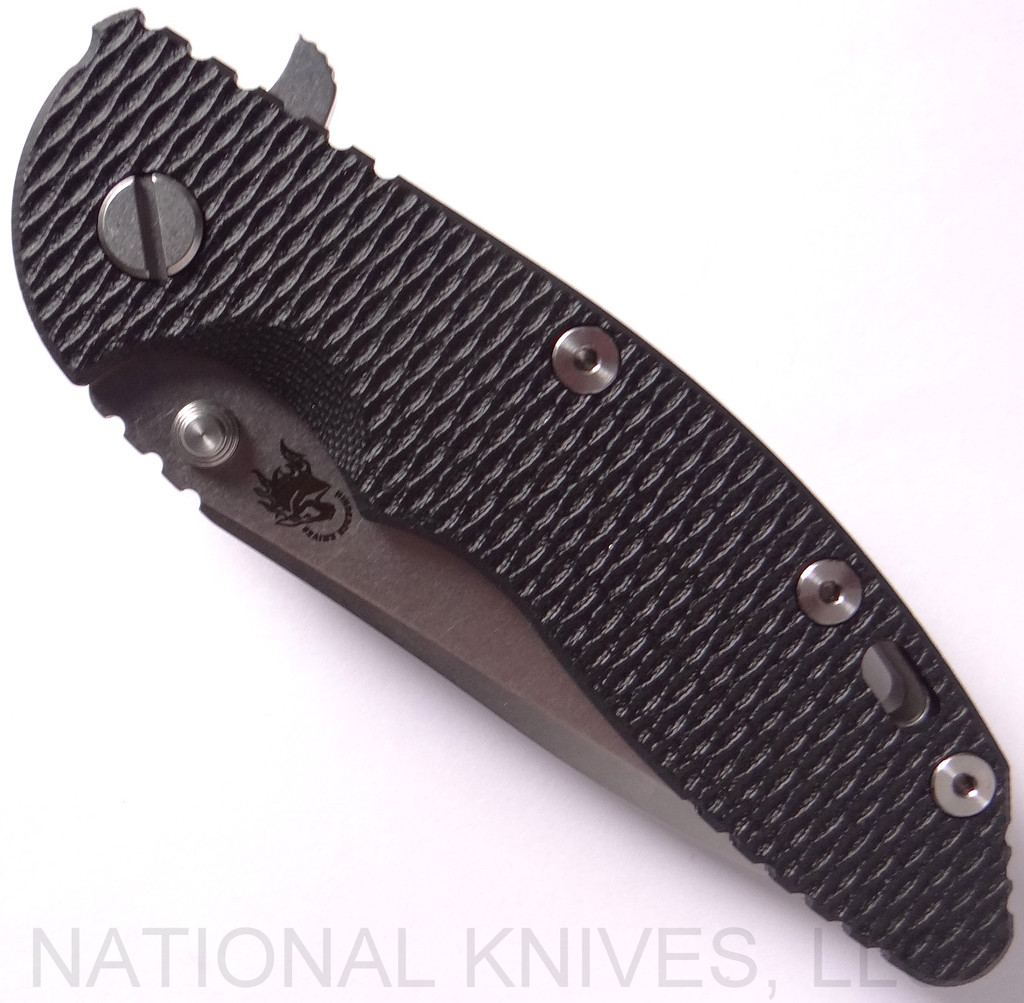Rick Hinderer Knives XM-18 3.5" Spanto folding knife with thumb stud and flipper tab - shown closed presentation side.  Stonewash 20CV stainless steel plain edge blade.  Black G-10 handle with stonewash lock side.  Model K2002SGS00.