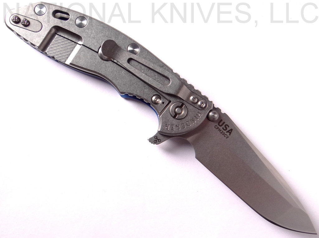 Rick Hinderer Knives XM-18 3.5" Spanto folding knife with thumb stud and flipper tab - shown open lock side.  Stonewash 20CV stainless steel plain edge blade.  Blue G-10 handle with stonewash lock side.  Model K2002SGS00.