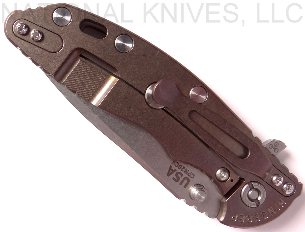 Rick Hinderer Knives XM-18 3.5" Spanto folding knife with thumb stud and flipper tab - shown closed lock side.  Stonewash 20CV stainless steel plain edge blade.  FDE G-10 handle with stonewash bronze lock side.  Model K2002SGSBR.
