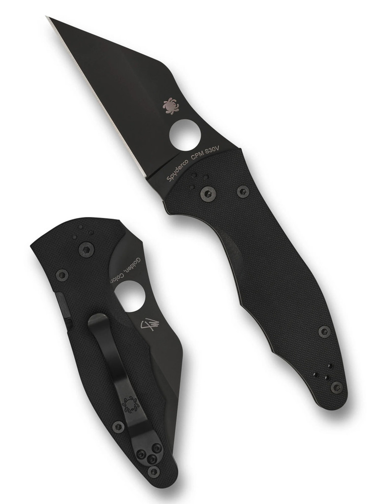 Spyderco Yojimbo 2 folding knife with thumb hole - shown open presentation side and closed pocket clip side.  Black S30V stainless steel plain edge blade.  Black G-10 handle. Model C85GPBBK2.