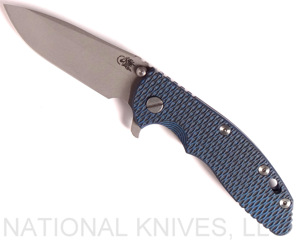 Rick Hinderer Knives XM-18 3.5" Spear Point folding knife with thumb stud and flipper tab - shown open presentation side.  Working Finish 20CV stainless steel plain edge blade.  Blue - black G-10 handle with Battle Blue lock side.  Model K2082SGW00.