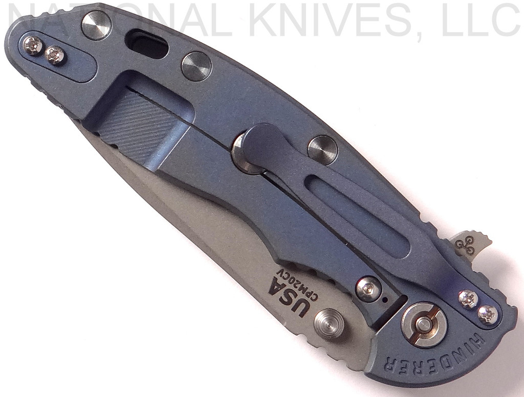 Rick Hinderer Knives XM-18 3.5" Spear Point folding knife with thumb stud and flipper tab - shown closed lock side.  Working Finish 20CV stainless steel plain edge blade.  Blue - black G-10 handle with Battle Blue lock side.  Model K2082SGW00.